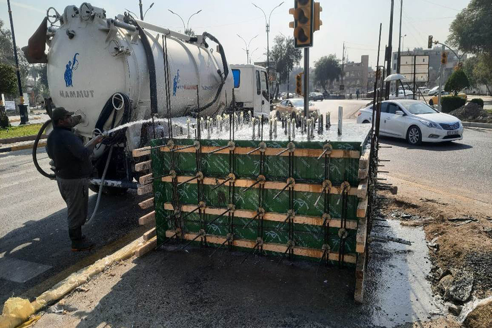 Works on gates and checkpoints at the entrances to the holy city of Kadhimiya, numbering (7)