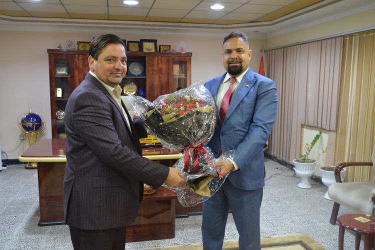 PRESENTING CONGRATULATION TO MR. GENERAL MANAGER OF AL-FAO GENERAL ENGINEERING COMPANY BY MR. GENERAL MANAGER OF NATIONAL CENTER FOR ENGINEERING CONSULTATIONS